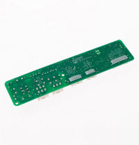 Green rectangular circuit board with silver solder points and white plastic connectors
